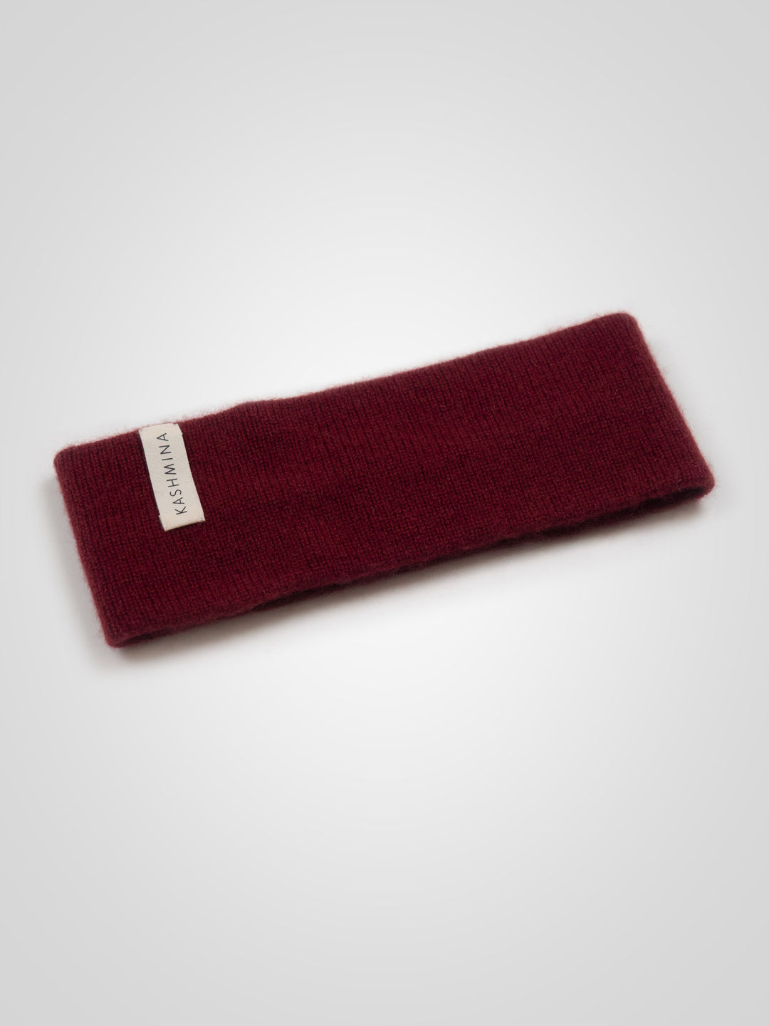 Pannebånd "Tiril" i 100 ren cashmere. Norsk design fra Kashmina. Farge: Bordeaux.